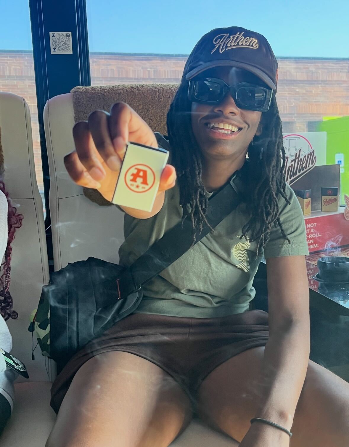 A SESH rep on the SESH Bus holding an Anthem product
